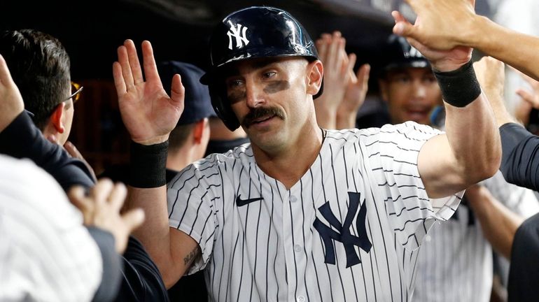 Matt Carpenter of the Yankees celebrates his fifth-inning three-run home run...