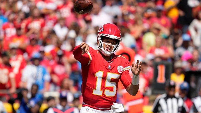 Kansas City Chiefs quarterback Patrick Mahomes (15) throws a pass...