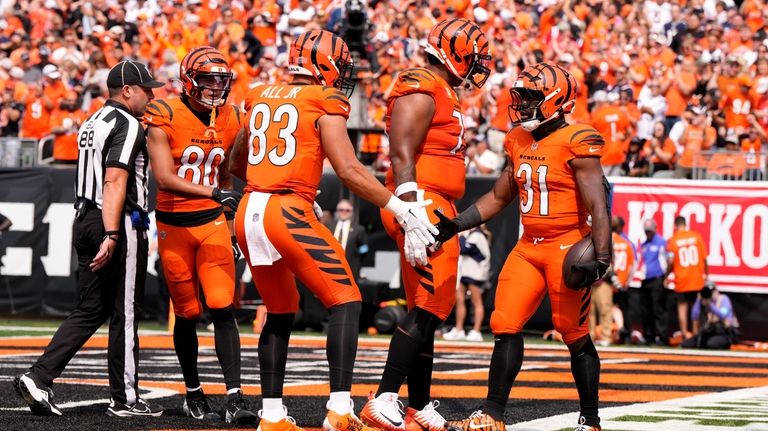 Cincinnati Bengals running back Zack Moss (31) celebrates with teammates...