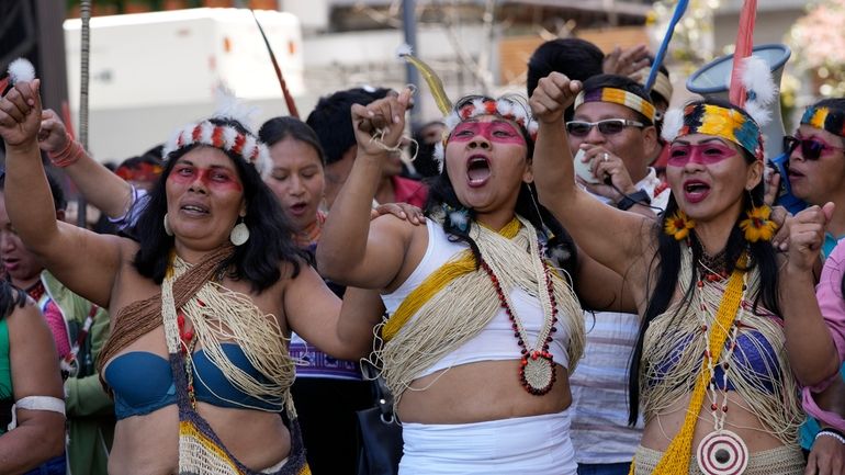 Waorani Indigenous women take part in a demonstration in Quito,...