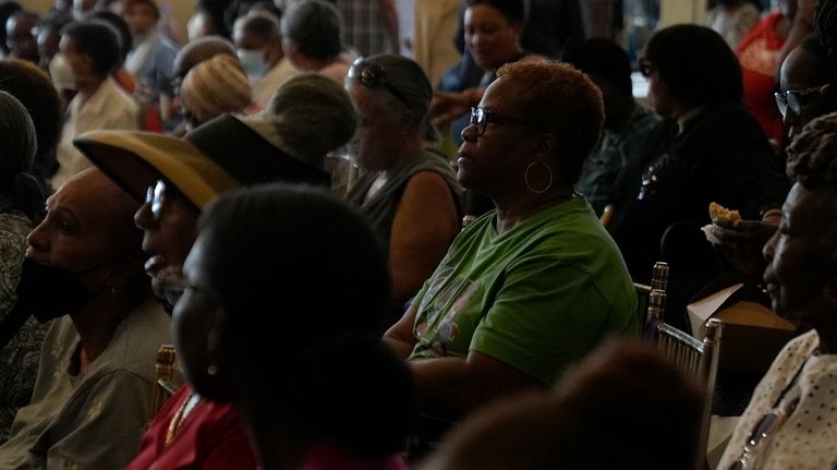 People listen to a lecture at the Black Health Matters...