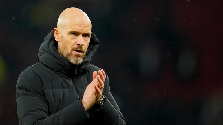 Manchester United's head coach Erik ten Hag applauds at the...