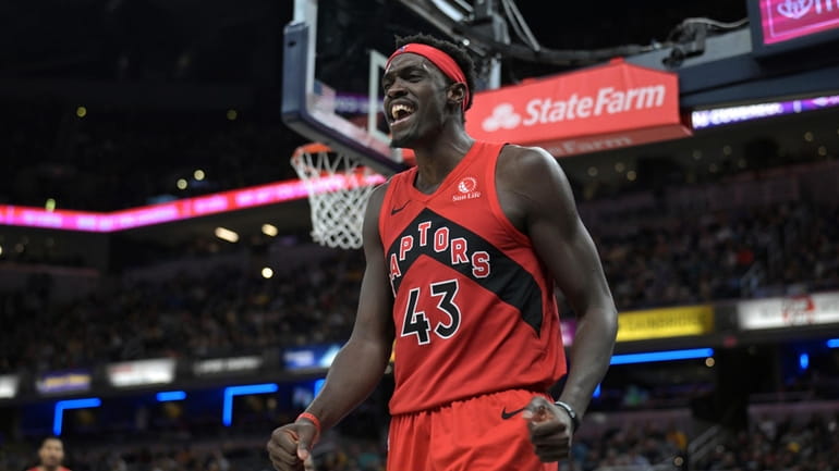 Toronto Raptors forward Pascal Siakam reacts after a making a...