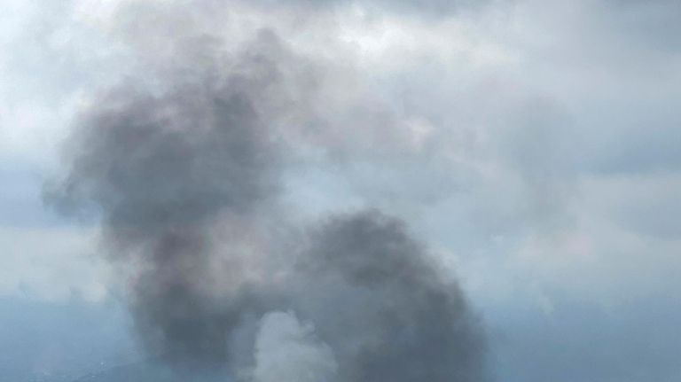 Smoke rises from the Tribhuvan International Airport in Kathmandu, Nepal,...