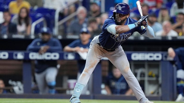 Tampa Bay Rays' Randy Arozarena, right, celebrates with Isaac Paredes after  hitting a three-run home run during the first inning of a baseball game  against the New York Yankees, Tuesday, Aug. 16