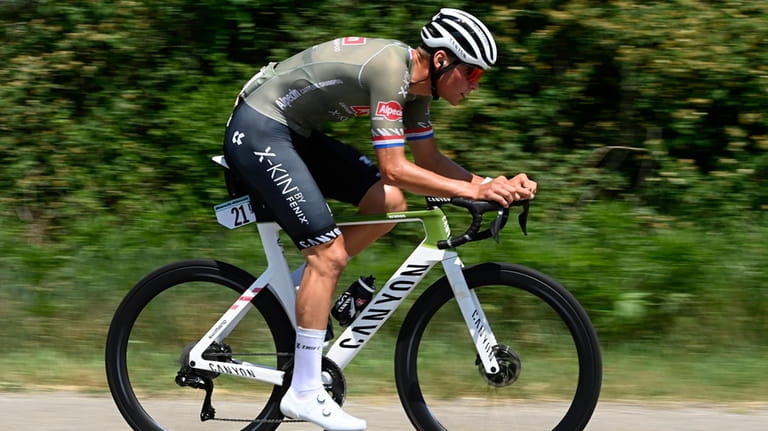 Dutch cyclist Mathieu Van der Poel competes during the 14th...