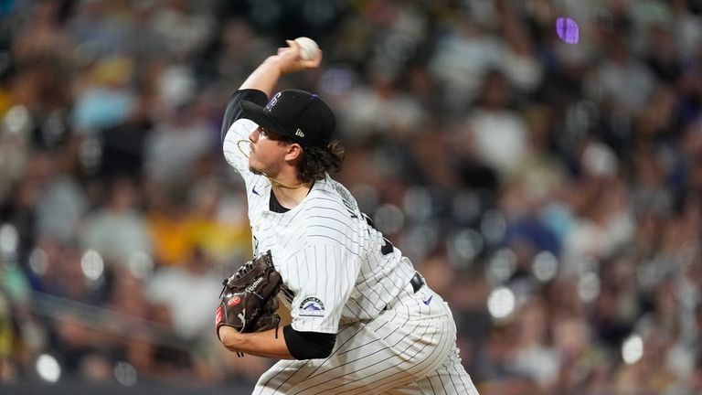 Colorado Rockies relief pitcher Victor Vodnik works against the San...