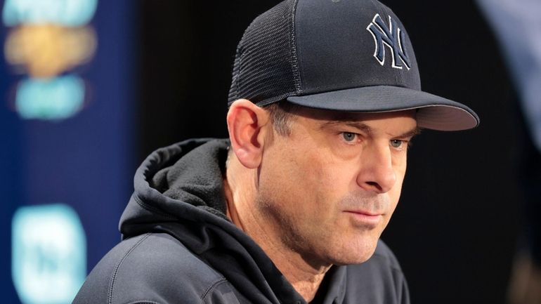 Yankees manager Aaron Boone (17) speaks to the media during...