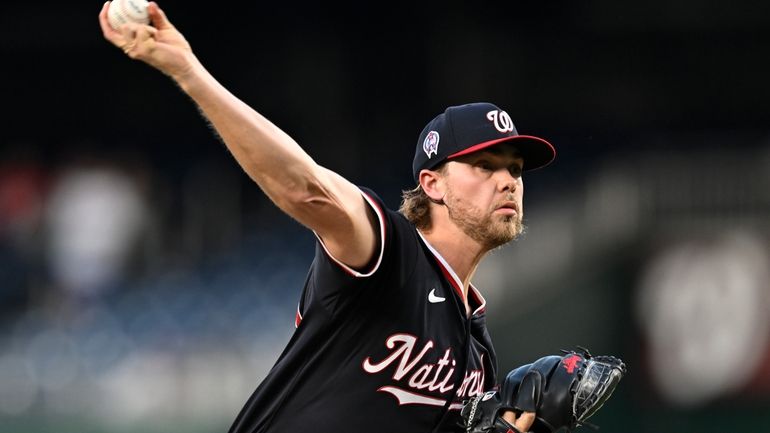 Washington Nationals starting pitcher Jake Irvin throws during the second...