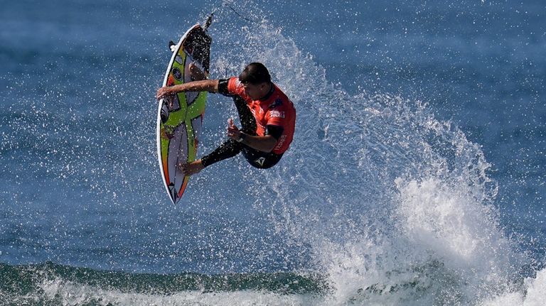 Jack Robinson, of Australia, goes airborne as he rides a...