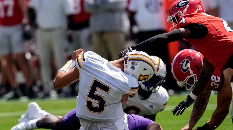 Tennessee Tech quarterback Jordyn Potts (5) is sacked by Georgia...