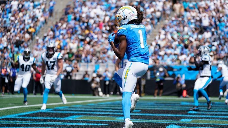 Los Angeles Chargers wide receiver Quentin Johnston scores during the...