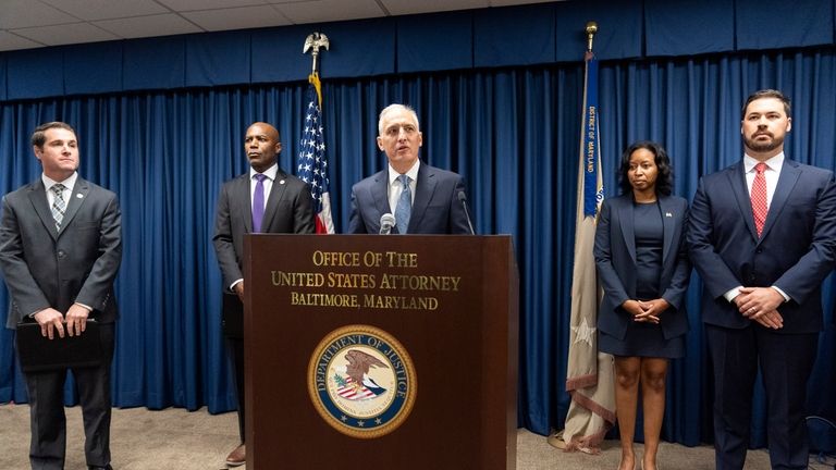 Assistant Attorney General for National Security Matthew G. Olsen, center,...