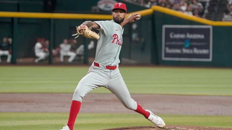 Philadelphia Phillies pitcher Cristopher Sánchez throws against the Arizona Diamondbacks...