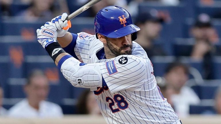 J.D. Martinez of the Mets bats during the third inning...