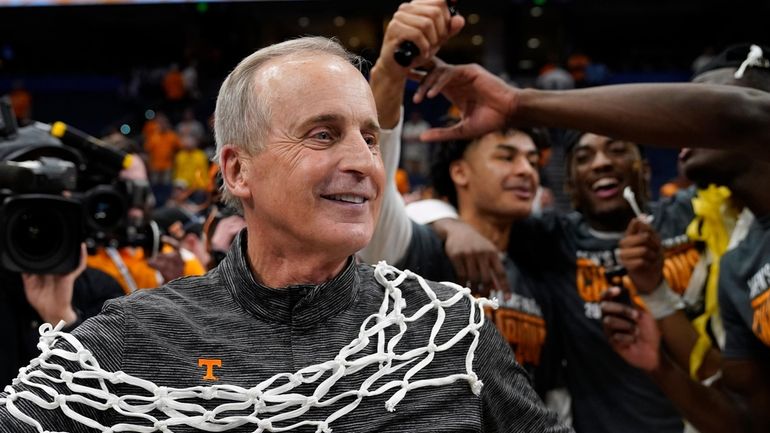 Tennessee head coach Rick Barnes celebrates after the team defeated...