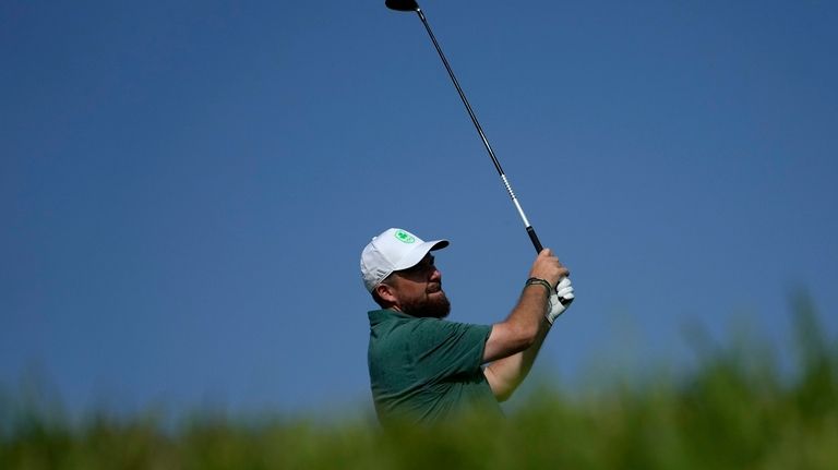 Shane Lowry, of Ireland, hits from the seventh tee during...