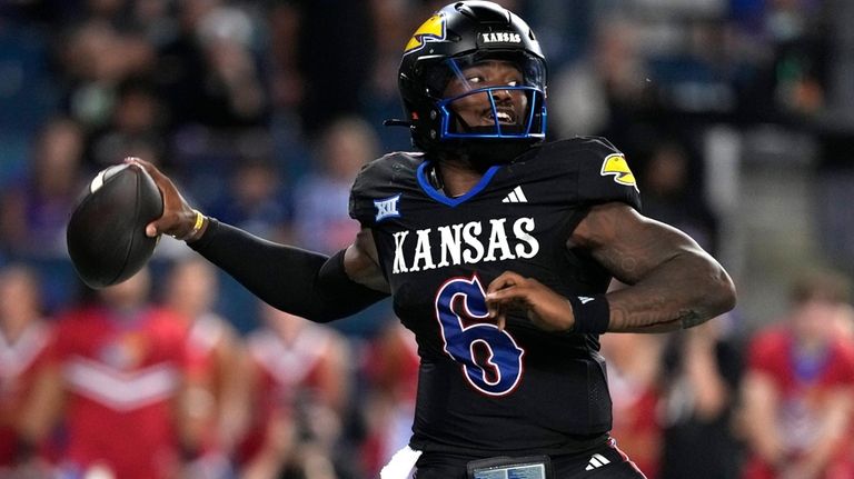 Kansas quarterback Jalon Daniels throws against UNLV in the second...