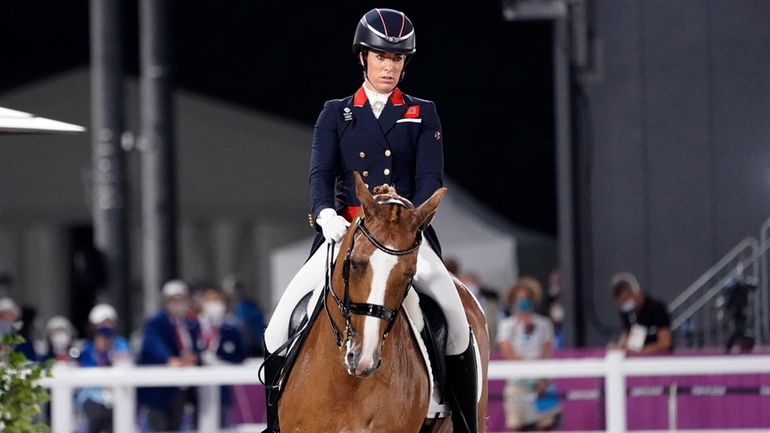 Britain's Charlotte Dujardin, riding Gio, competes in the equestrian dressage...