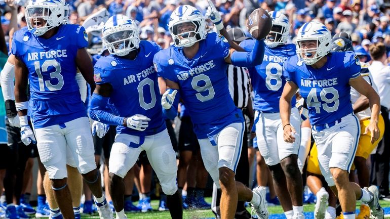 Air Force Falcons cornerback Levi Brown (9) celebrates with teammates...