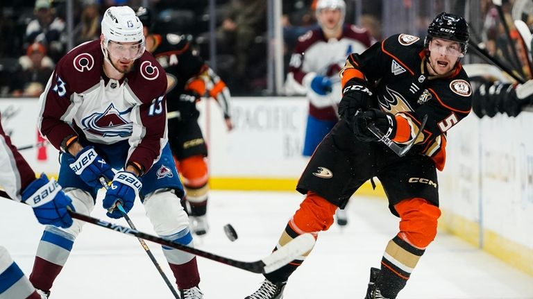 Anaheim Ducks defenseman Urho Vaakanainen (5) sends the puck ahead...