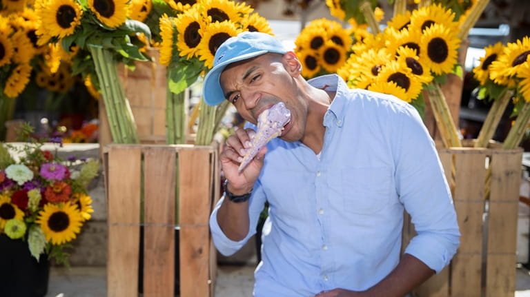 Alain Charles Espinoza, of Huntington, eats an apple pie ice...