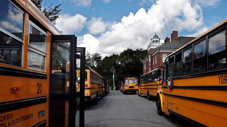 In this Thursday, Sept. 14, 2017, file photo, buses await...