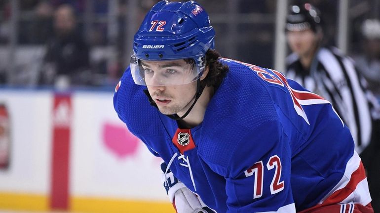 Rangers center Filip Chytil sets before a face-off against the...