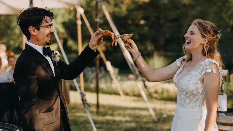 Smith and Gugliada celebrate with pizza from Rolling in Dough...