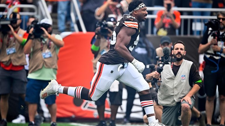 Cleveland Browns defensive end Myles Garrett runs onto the field...