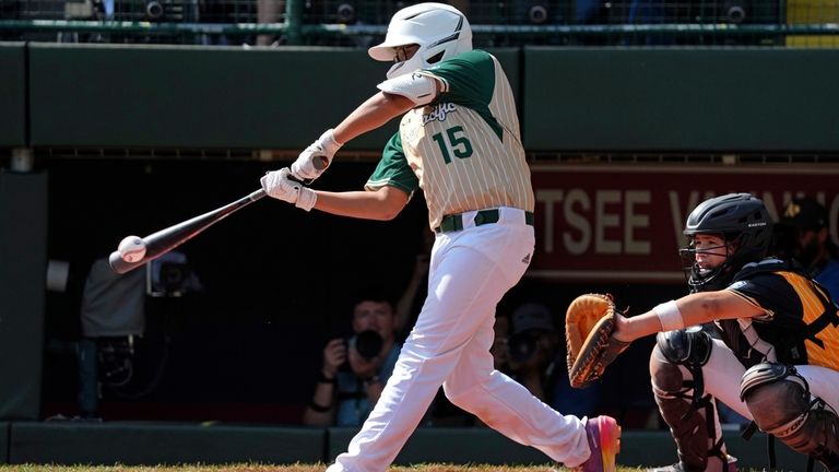 Taiwan's Hu Yen-Chun (15) hits a single off Lake Mary,...