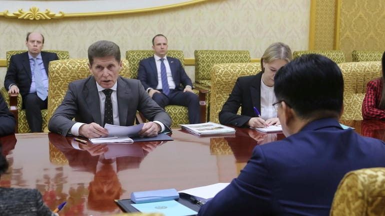 Oleg Kozhemyako, left, governor of the Primorye region in the...