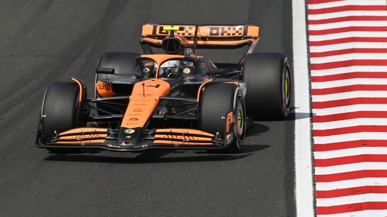 McLaren driver Lando Norris of Britain steers his car during...