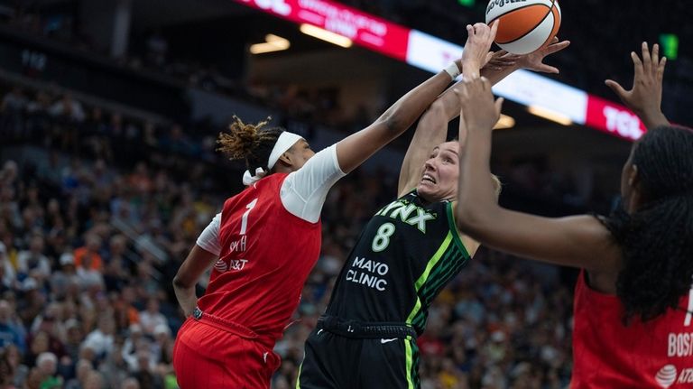 Indiana Fever forward Aliyah Boston (7) blocks Minnesota Lynx forward...