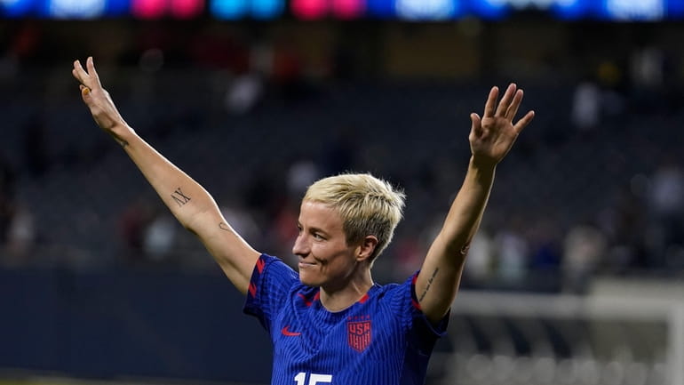 United States forward Megan Rapinoe finally leaves the field after...