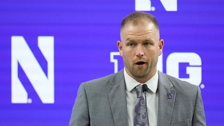 Northwestern head coach David Braun speaks during an NCAA college...