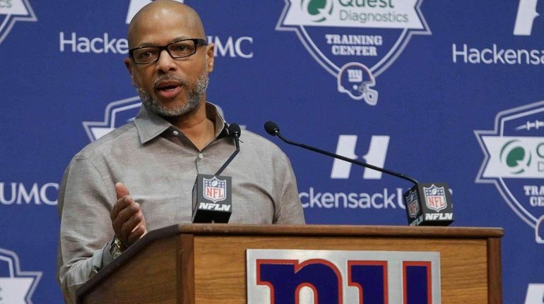 New York Giants general manager Jerry Reese responds to a...