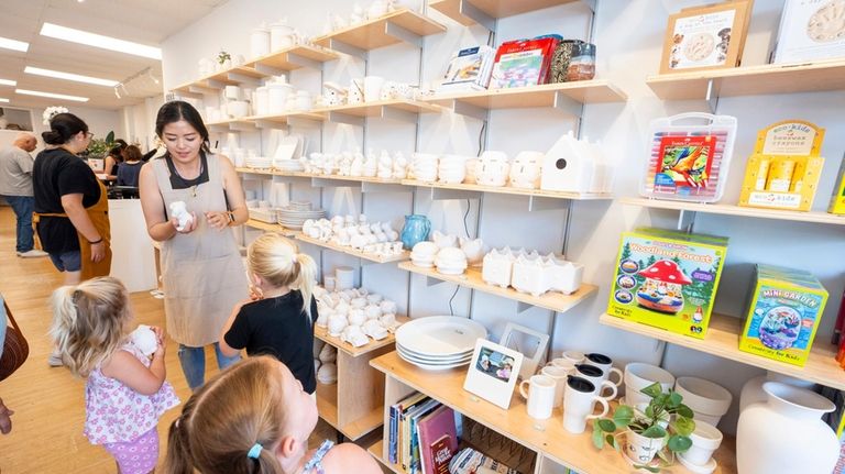 Children choose their pottery at Earth Arts in Long Beach...