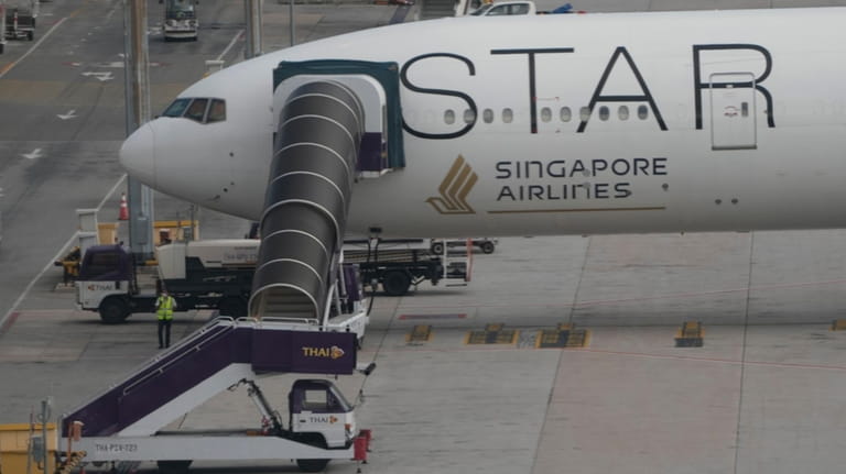 The Boeing 777-300ER aircraft of Singapore Airlines, is parked after...