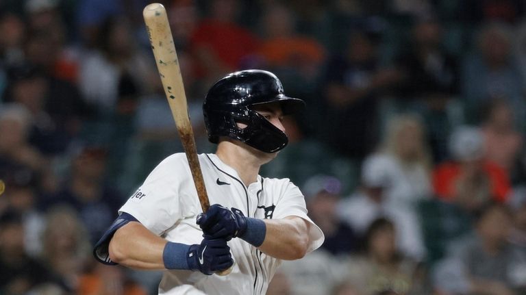 Detroit Tigers' Trey Sweeney singles against the Colorado Rockies during...