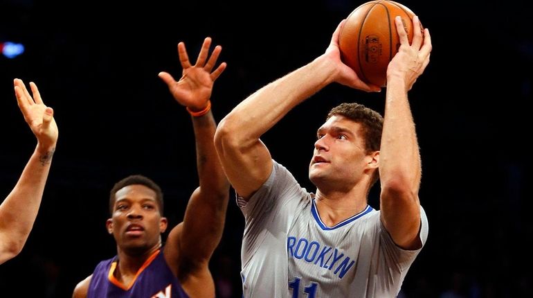 Brook Lopez #11 of the Brooklyn Nets puts up a...