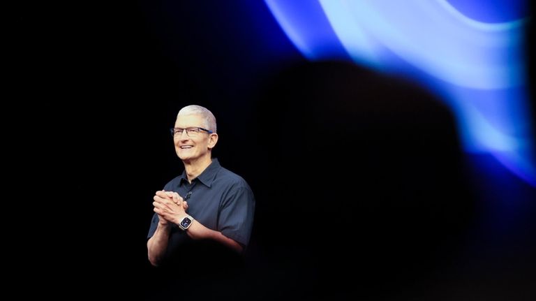 Apple CEO Tim Cook walks on the stage during an...