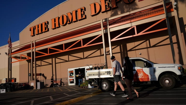 File - Customers arrive at a Home Depot store in...