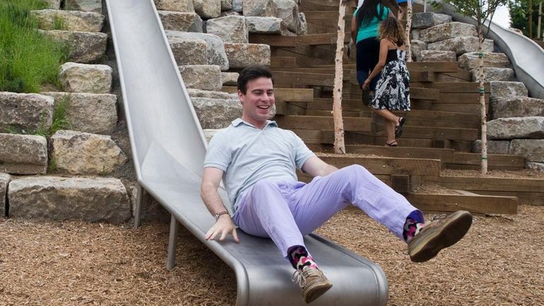 Visitors play on the slides on Slide Hill on Governors...