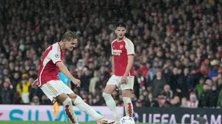 Arsenal's Martin Odegaard scores during the Group B Champion League...