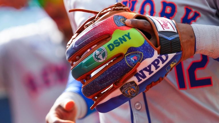 Francisco Lindor of the Mets wears a glove commemorate first...