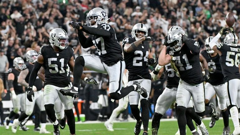 Las Vegas Raiders cornerback Tyler Hall (37) celebrates an interception...