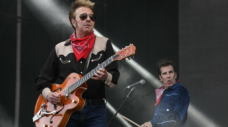 Singer and guitarist Brian Setzer, left, and drummer Slim Jim Phantom,...