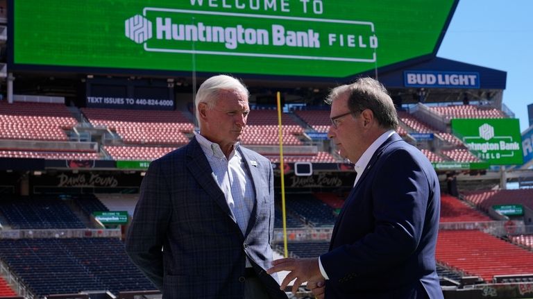 Cleveland Browns owner Jimmy Haslam, left, and Huntington Banks' Steve...