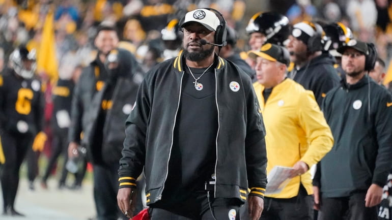 Pittsburgh Steelers head coach Mike Tomlin watches from the sidelines...
